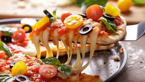 Op kaaspizzadag eten we uiteraard pizza!