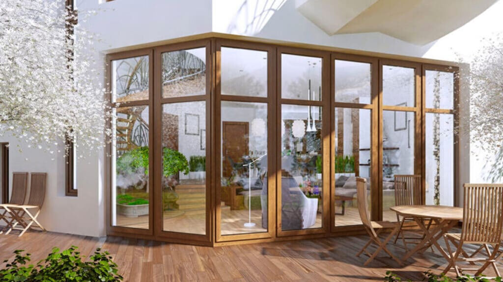 Het hele jaar van je tuin genieten? Kies voor een veranda met glazen schuifwand!